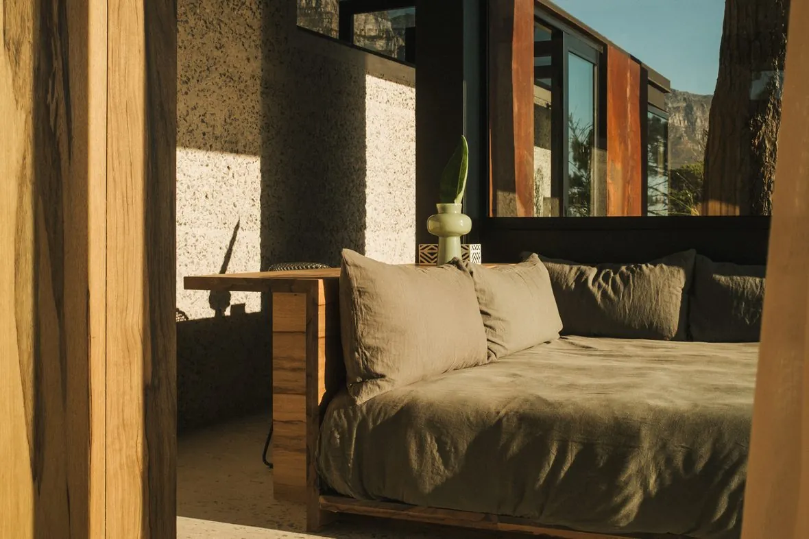 The bed on its podium, under the panorama window